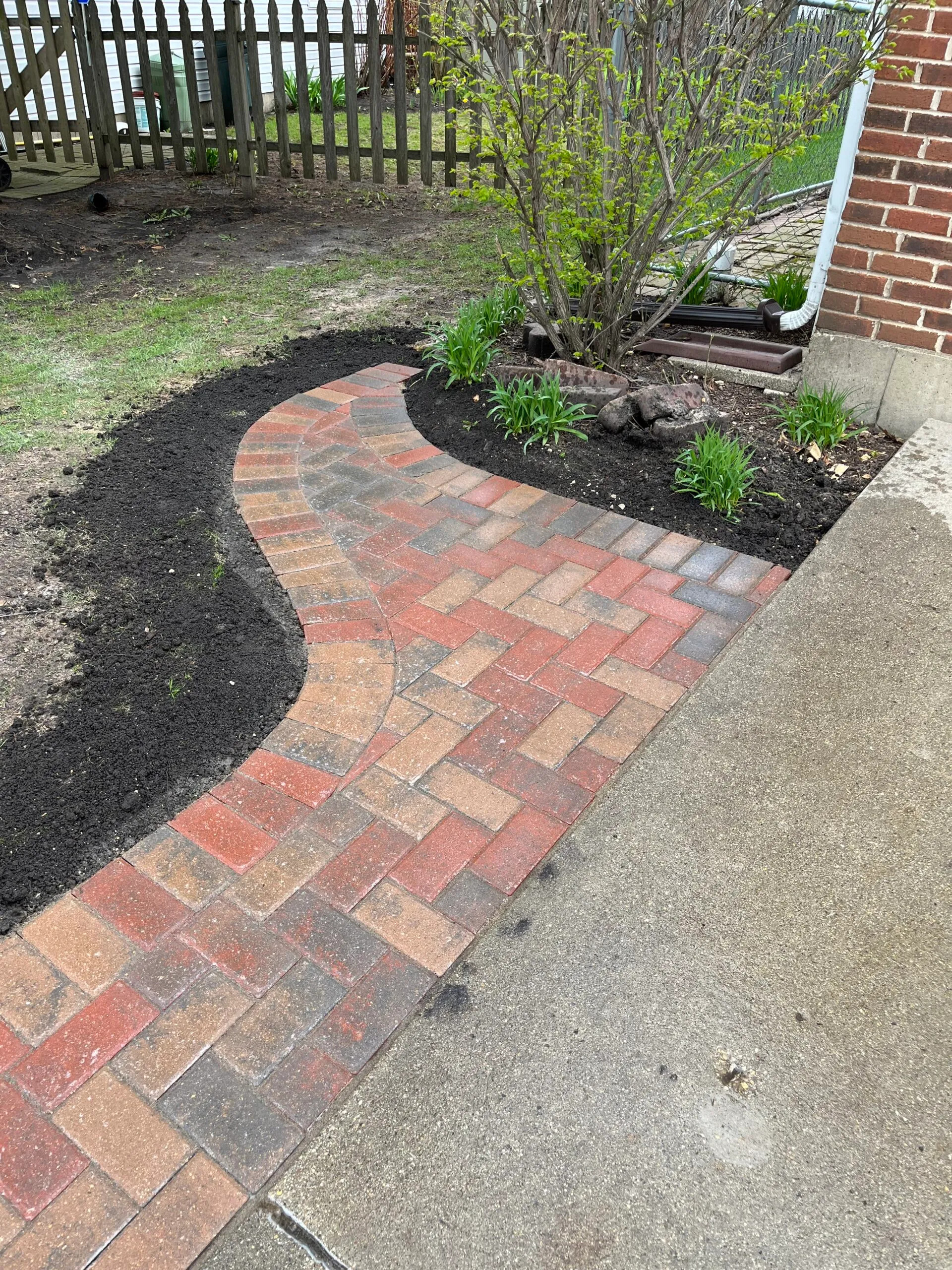 Curved clay paver walkway