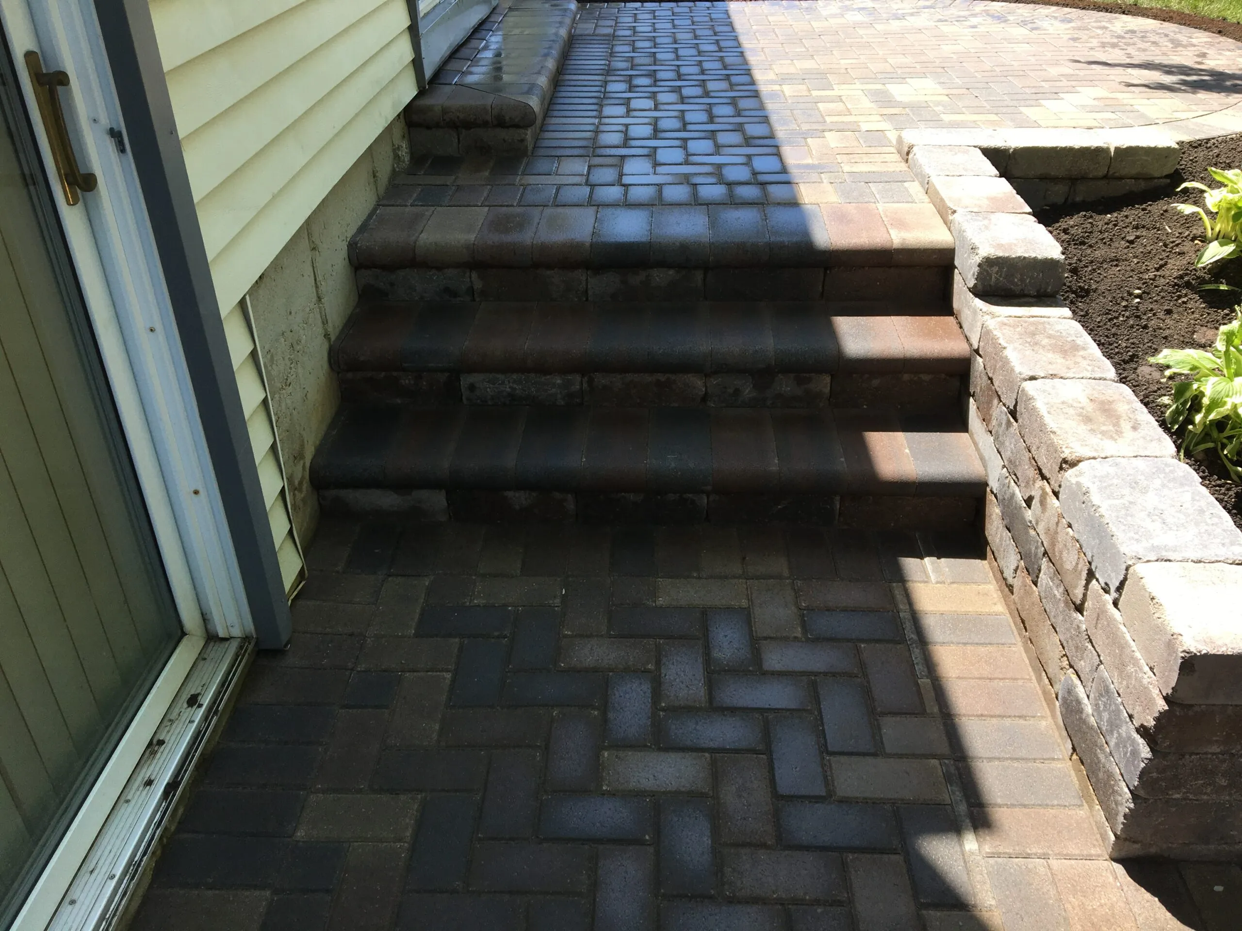 Herringbone paver steps and retaining wall